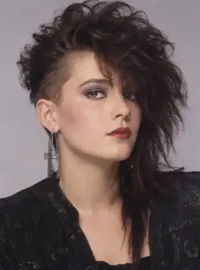 AI-generated portrait of a woman with a choppy teased dark shag and a cross earring